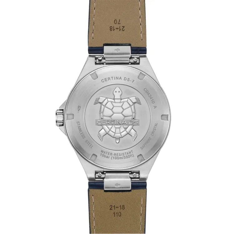 Back view of the Certina DS-7 Quartz watch showcasing its stainless steel case and engraved case back featuring the Certina turtle emblem. The engravings highlight key details such as 'Certina DS-7,' water resistance up to 100 meters (10 bar), and sapphire crystal construction. The dark blue leather strap is partially visible, showing its beige underside with size markings and a stainless steel buckle attachment.