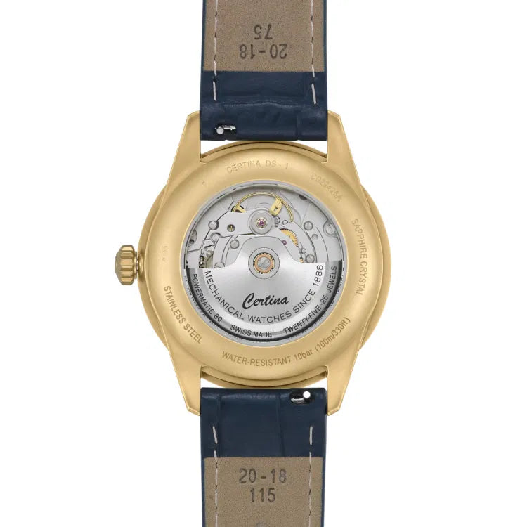 Caseback view of the Certina DS-1 Big Date Powermatic 80 watch featuring a gold-tone PVD-coated stainless steel case and visible Powermatic 80 automatic movement through a transparent sapphire crystal. The engraved rotor reads "Certina", "Mechanical Watches Since 1888", and "Swiss Made". The blue leather strap includes visible inner markings “20–18 115” and “75”, indicating 20 mm lug width, 18 mm buckle width, and strap lengths of 115 mm and 75 mm.