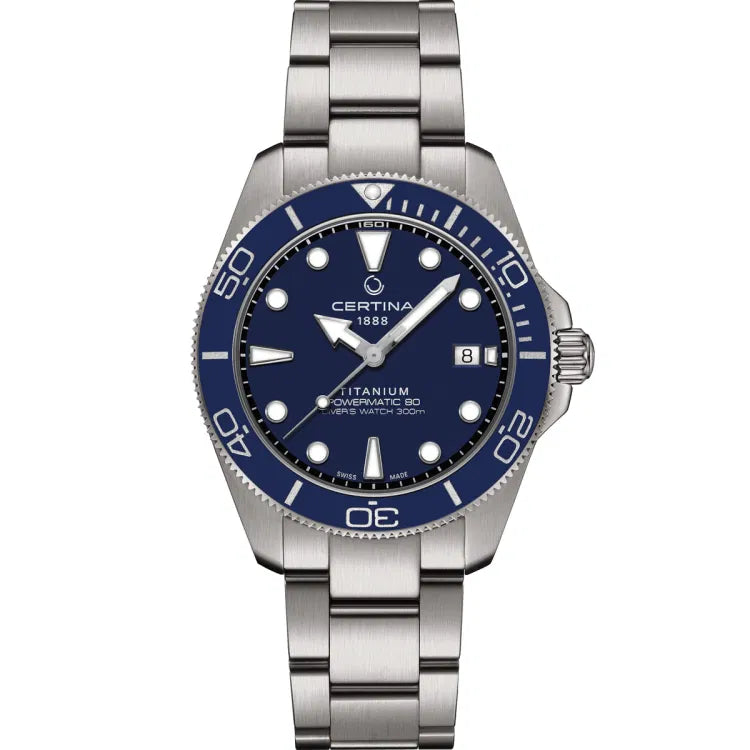 Front view of the Certina DS Action Diver 40.5mm watch with a titanium bracelet and blue ceramic bezel featuring white minute markers. The blue dial displays luminous indices, silver-toned hands, and the inscriptions “CERTINA 1888,” “TITANIUM,” “POWERMATIC 80,” and “DIVER’S WATCH 300m.” A date window is located at the 3 o'clock position.