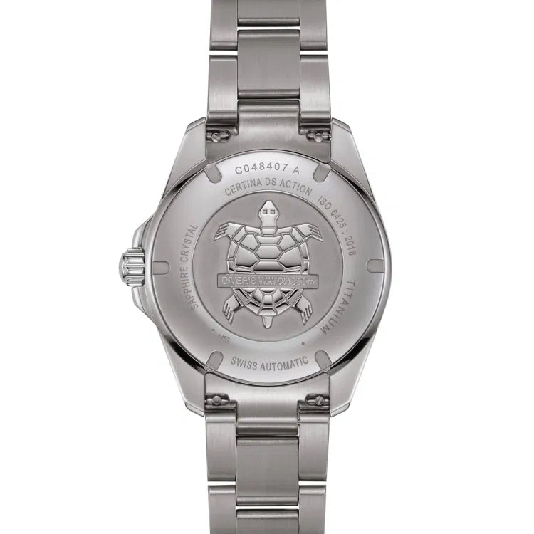 Back view of the Certina DS Action Diver 40.5mm watch with a titanium case and bracelet. The case back features an engraved turtle emblem and the text “DIVER’S WATCH 300m.” Surrounding engravings include the reference number C048407 A, “CERTINA DS ACTION,” “ISO 6425:2018,” “TITANIUM,” “SAPPHIRE CRYSTAL,” and “SWISS AUTOMATIC.”