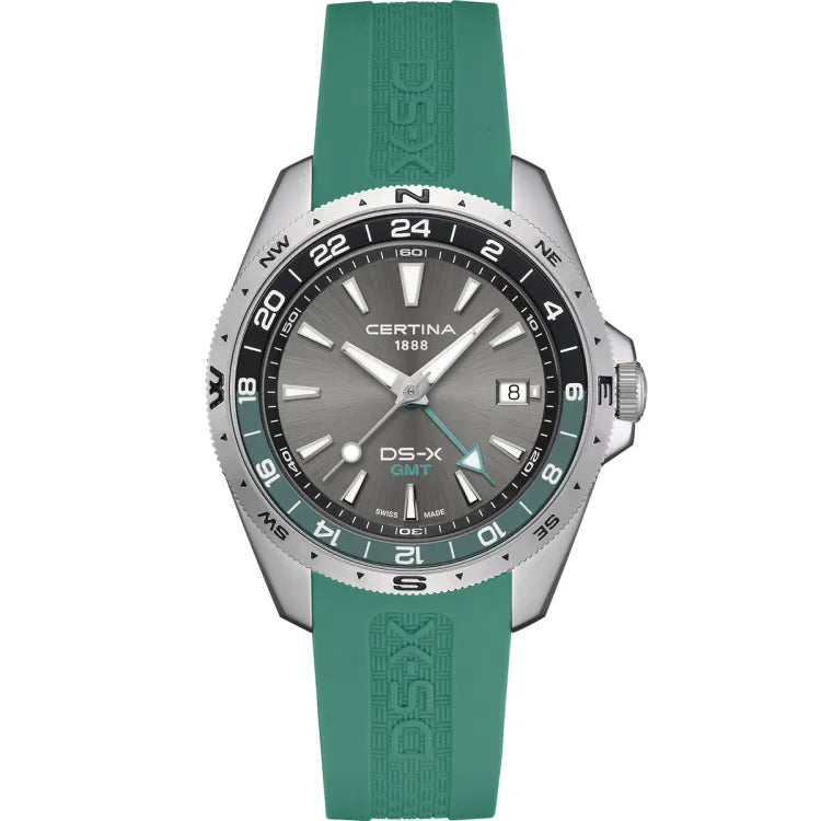 certina ds-x gmt c047.452.17.081.00 front view showing certina 1888 logo, grey dial, green 24h bezel matching green rubber strap, swiss made label at 6 o’clock