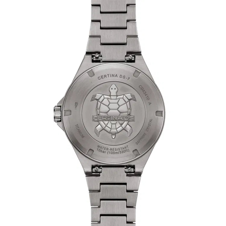 Back view of the Certina DS-7 Quartz watch showcasing the engraved titanium case back with the Certina turtle emblem. The engravings highlight key details such as 'Certina DS-7,' water resistance up to 100 meters (10 bar), sapphire crystal, and full titanium construction. The butterfly clasp with push buttons ensures a secure and comfortable fit.