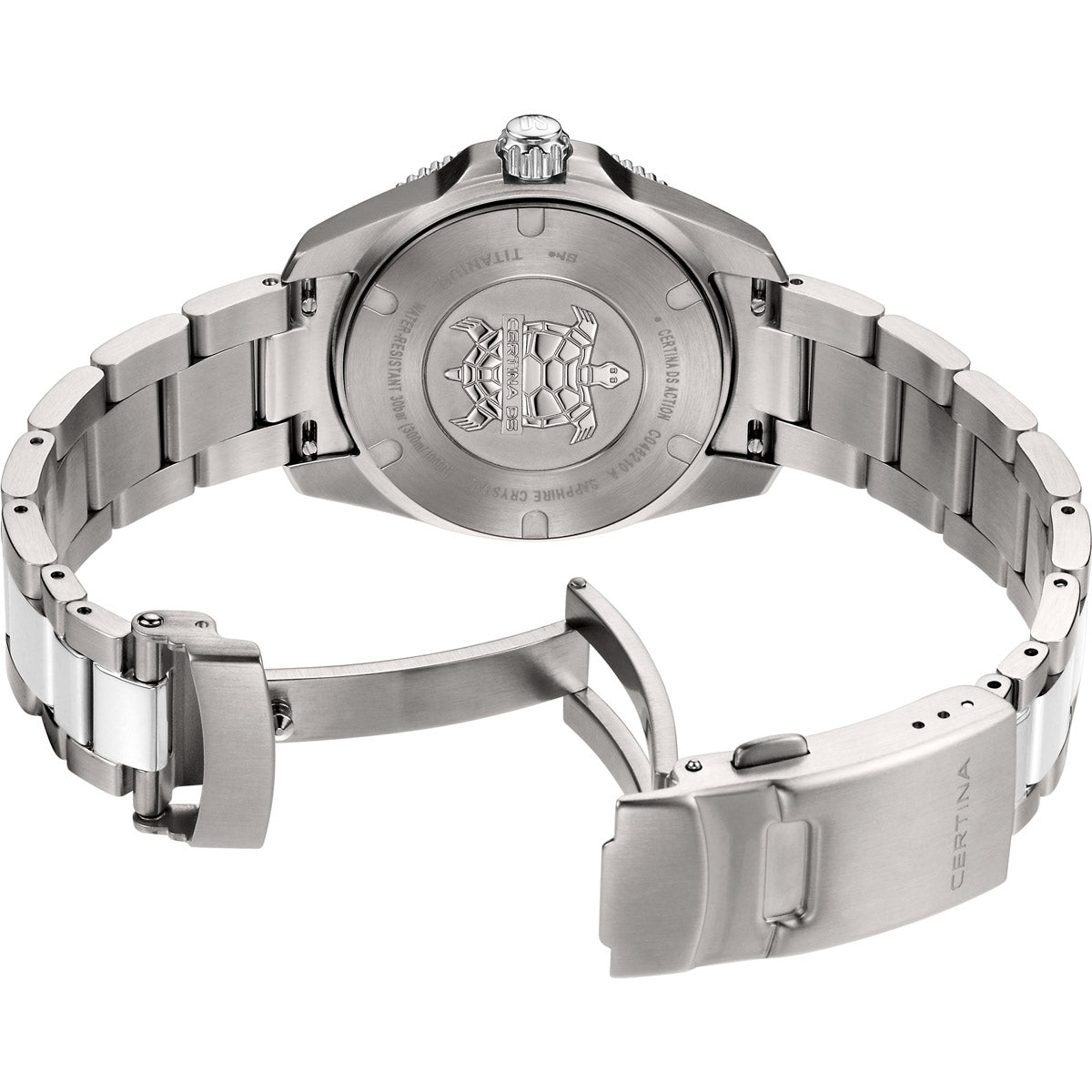 The Certina DS Action 34.5mm titanium watch is shown lying on its side with an open folding clasp. The embossed turtle logo is centered on the brushed titanium case back, surrounded by engraved details including water resistance (300M), titanium material, and sapphire crystal. The screw-down crown is visible at the top, and the bracelet’s folding clasp is engraved with "Certina" branding, highlighting its lightweight yet durable design.