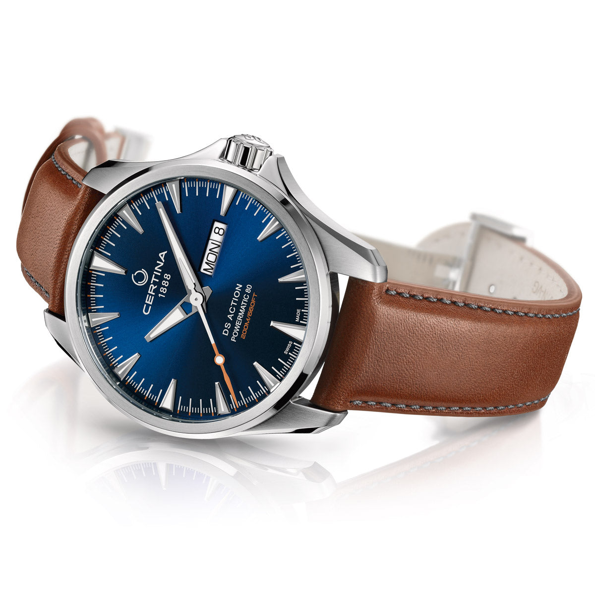 Men's Certina DS Action Day-Date Powermatic 80 watch laying on its side, showcasing the stainless steel case profile, polished edges, and brown leather bracelet. The sleek dial with day and date windows is visible, along with the side view of the crown. A stylish and durable timepiece with an automatic movement and water resistance up to 200 meters (20 bar)